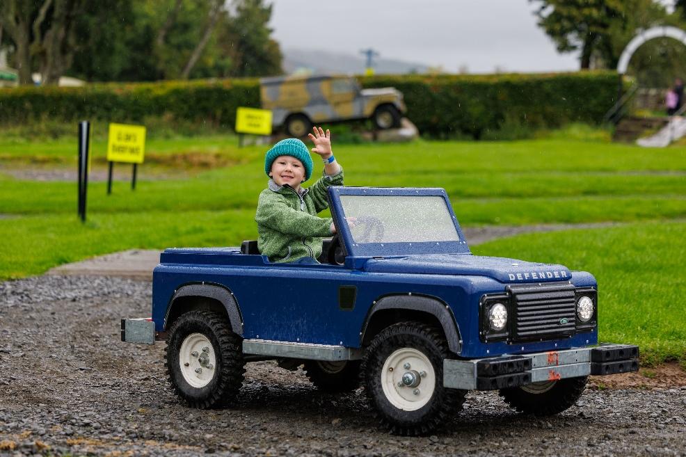 picture of a child driving a toy Landrover at Action Glen