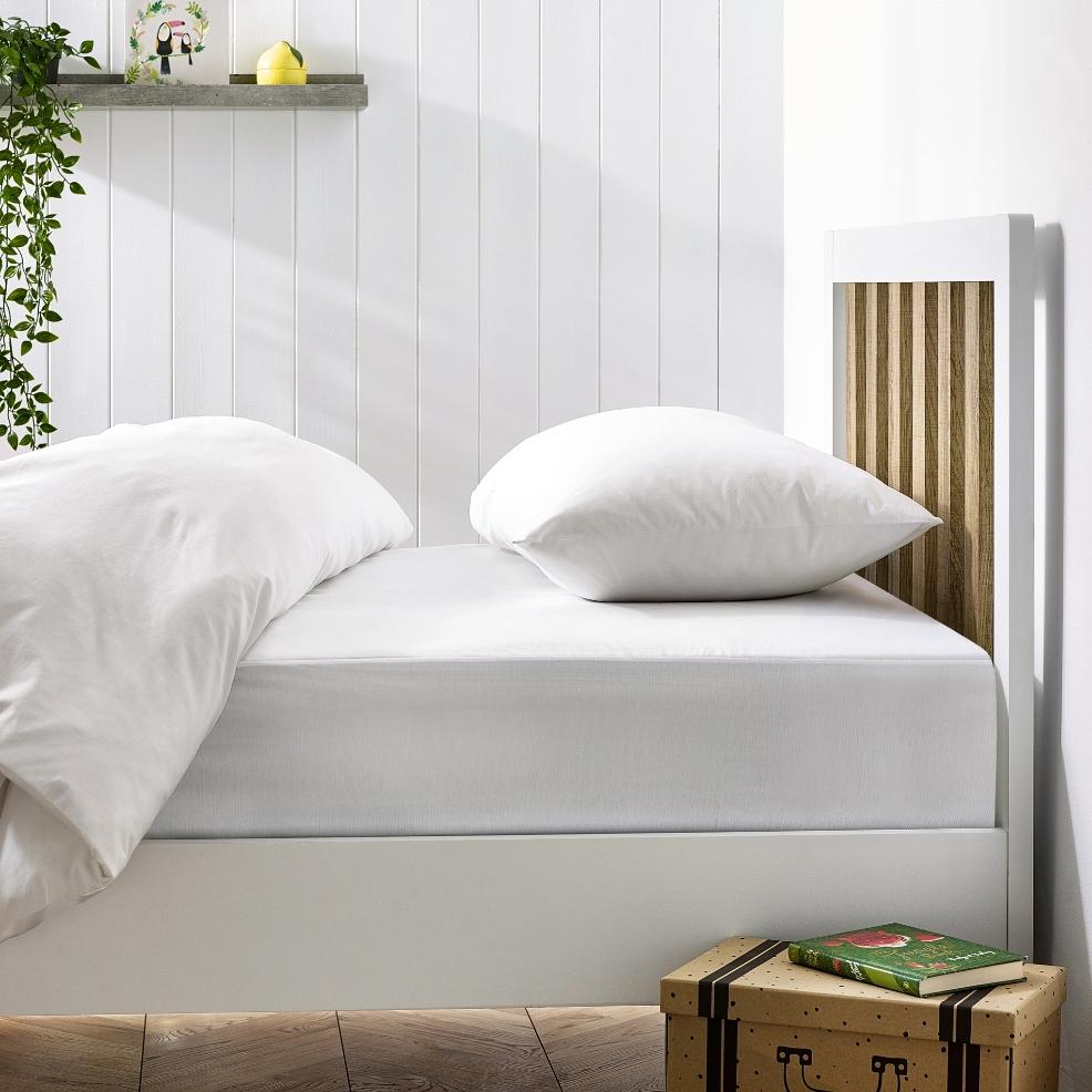 picture of a bed with Hippychick Fitted Tencel bedding