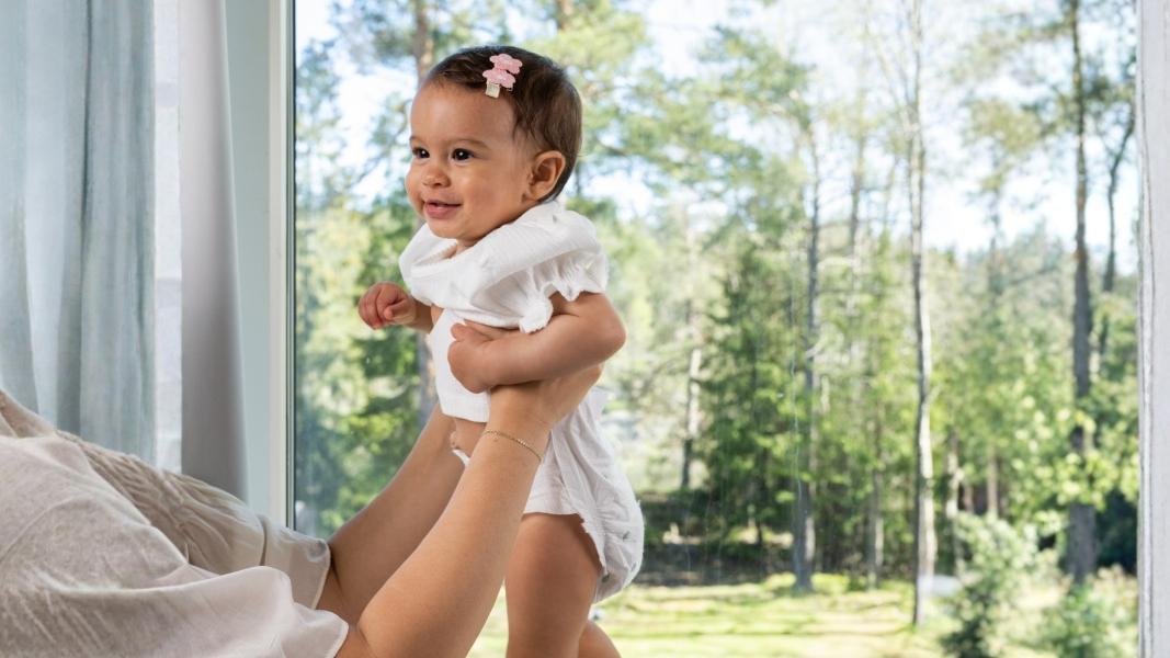 a happy baby wearing a Naty bamboo nappy for world bamboo day pictue of a happy baby wearing a Naty bamboo nappy for world bamboo day
