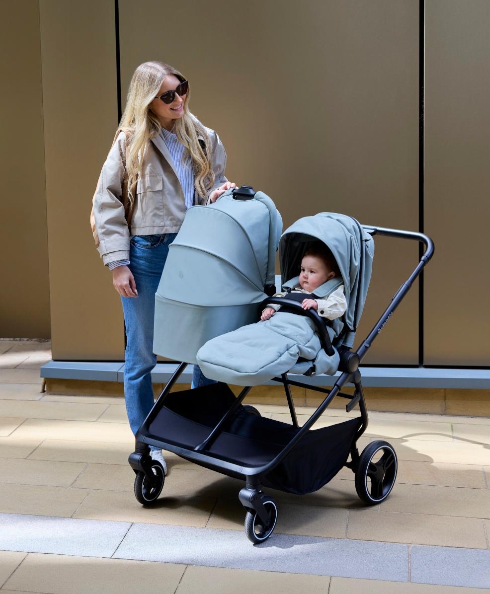 a happy mum and baby using the Ickle Bubba Altair Double Pram in grey picture of a happy mum and baby using the Ickle Bubba Altair Double Pram in grey