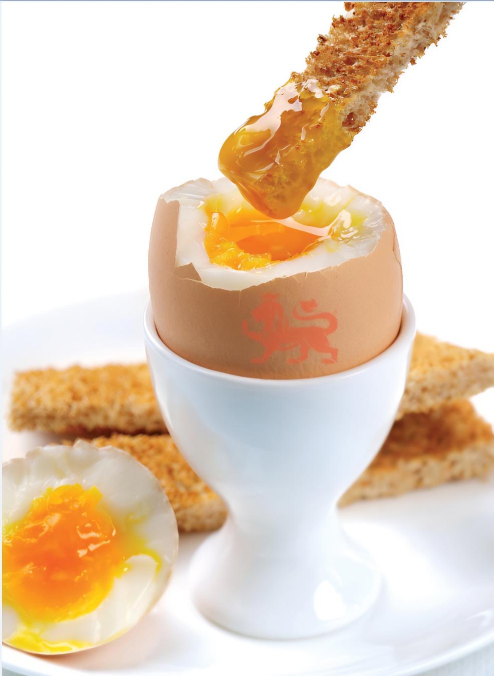 Boiled eggs with the British Lion Eggs stamp on with toast fingers being dipped in picture of Boiled eggs with the British Lion Eggs stamp on with toast fingers being dipped in