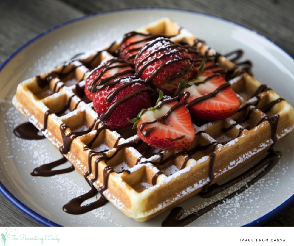 picture of a breakfast waffle with strawberries and chocolate sauce for an easy teen breakfast