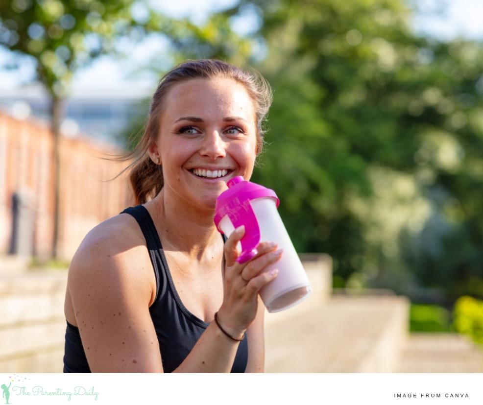 picture of a happy healthy mum drinking a protein shake