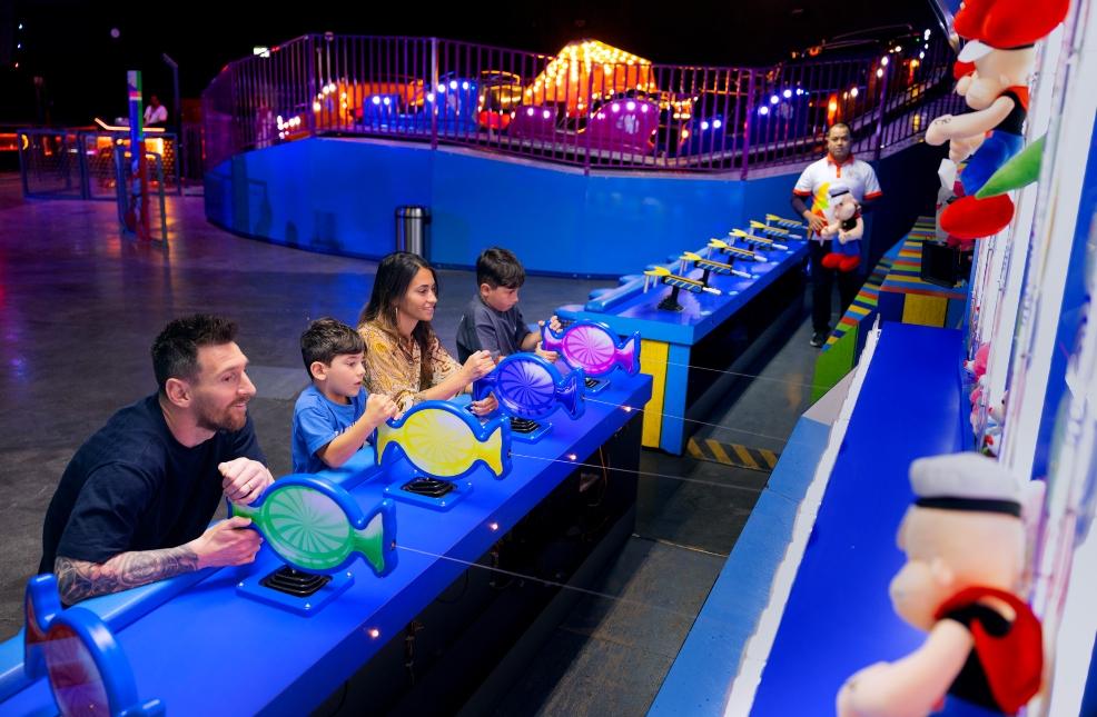 picture of Leo Messi and wife Antonella and kids Mateo and Ciro play arcade games at Boulevard Riyadh City