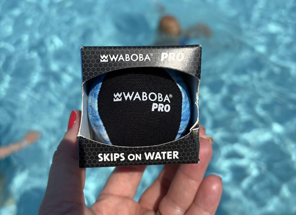 the waboba pro swim ball in a swimming pool picture of the waboba pro swim ball in a swimming pool