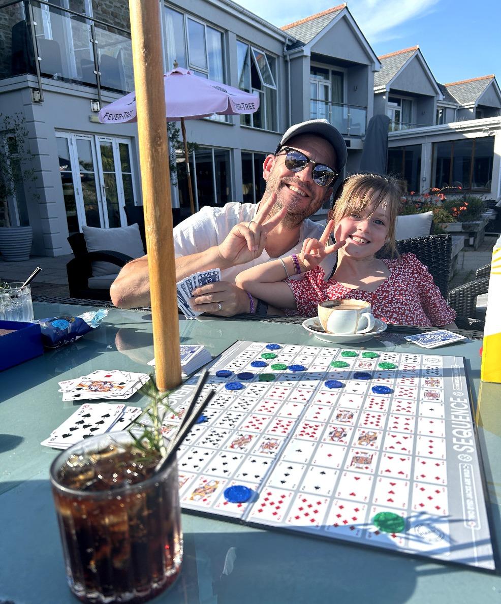 picture of a happy father and daughter playing boardgames at The Llawnroc Hotel Gorran Haven