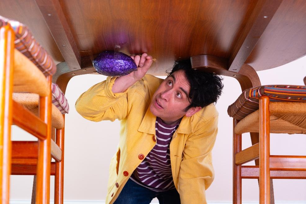 picture of magician Pete Firman hiding cadbury easter eggs to make easter hunt more fun