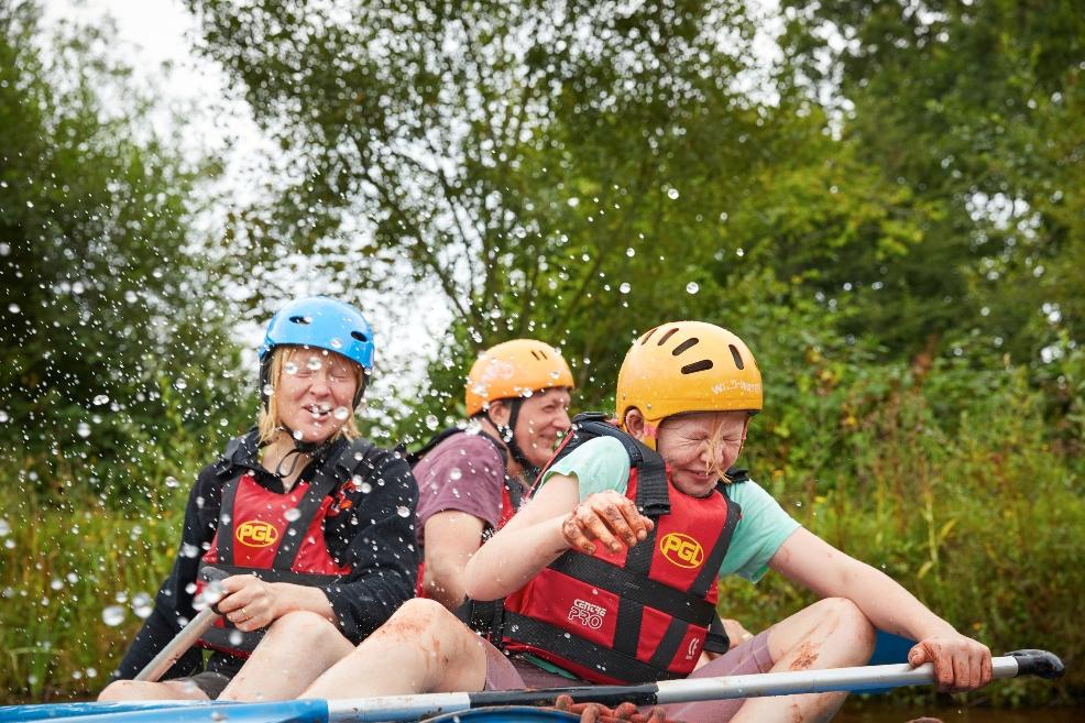 happy children enjoying watersports at a PGL kids camp over October half term picture of happy children enjoying watersports at a PGL kids camp over October half term