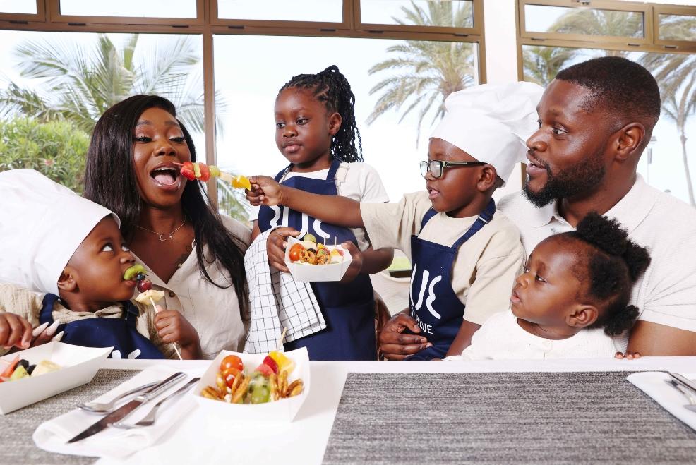 picture of a family eating veg skewers