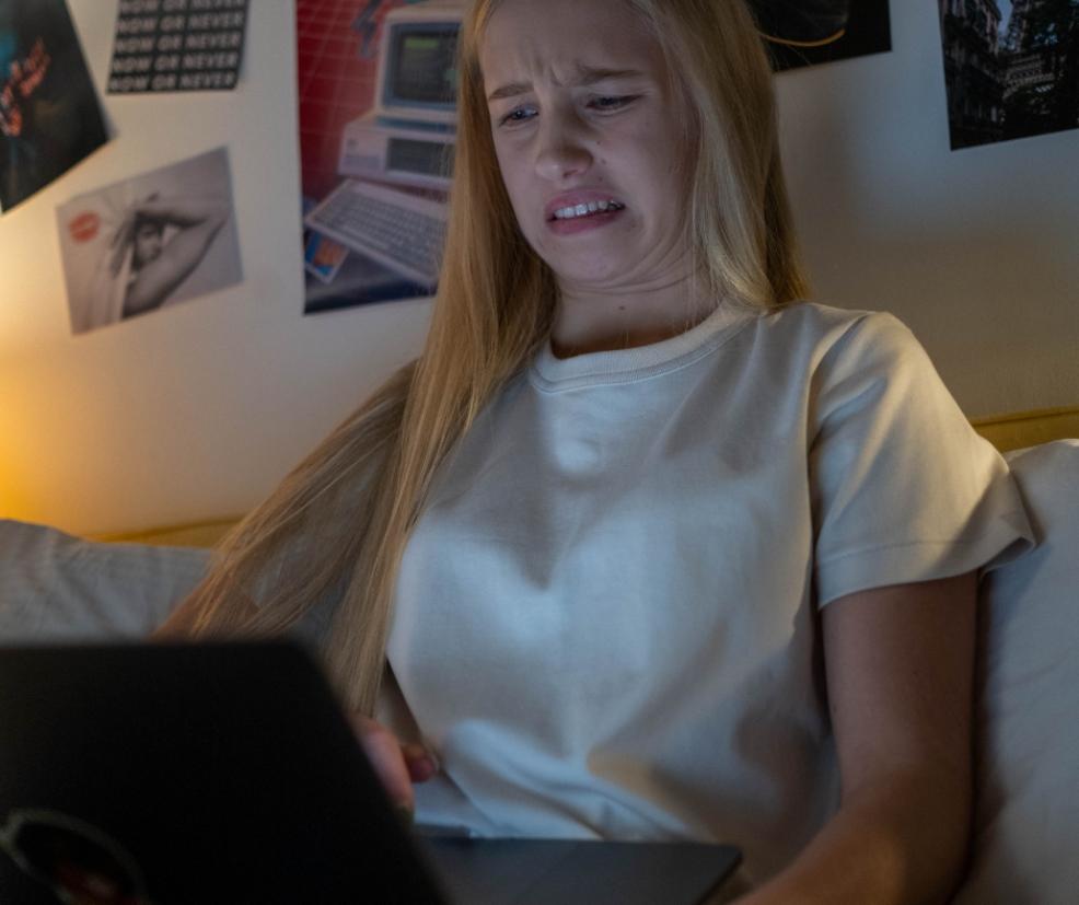picture of a Teen looking at something inappropriate online