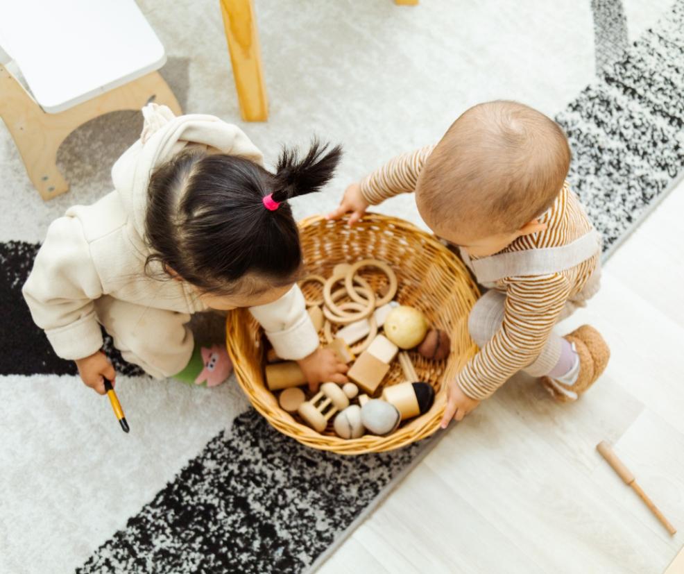 picture of babies playing with wooden musical instrument sensory toys
