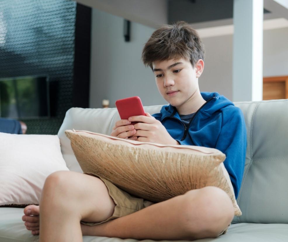 boy on a smartphone picture of a boy on a smartphone