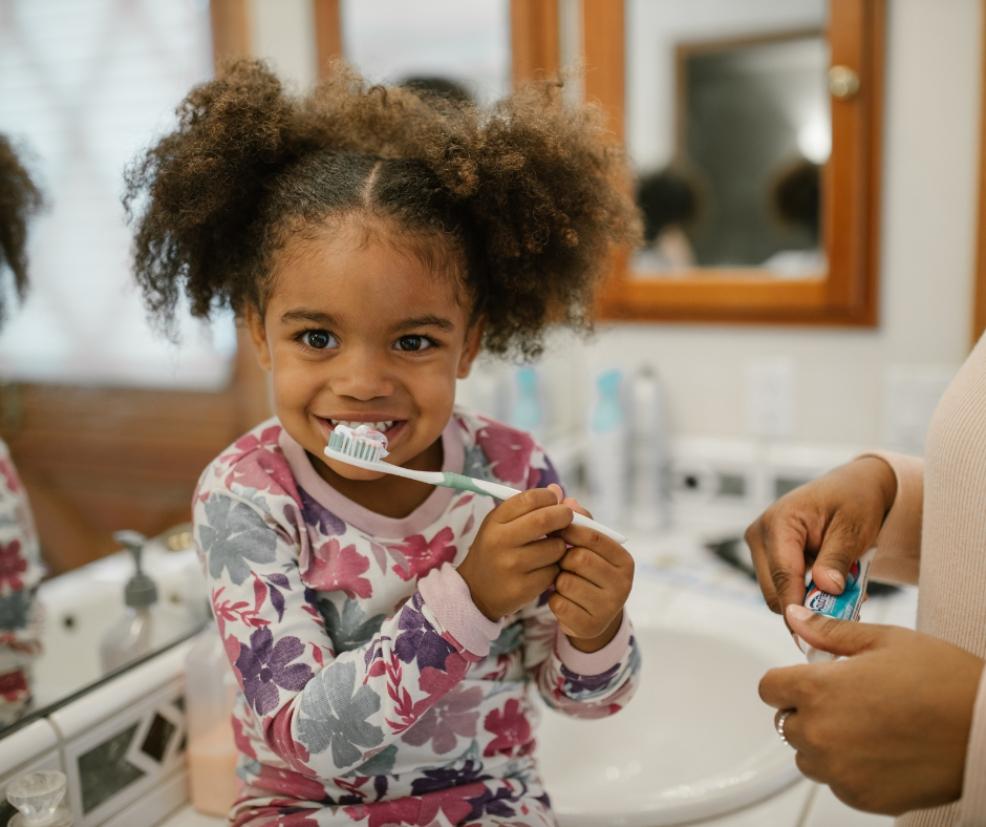 picture of a child brushing her teeth