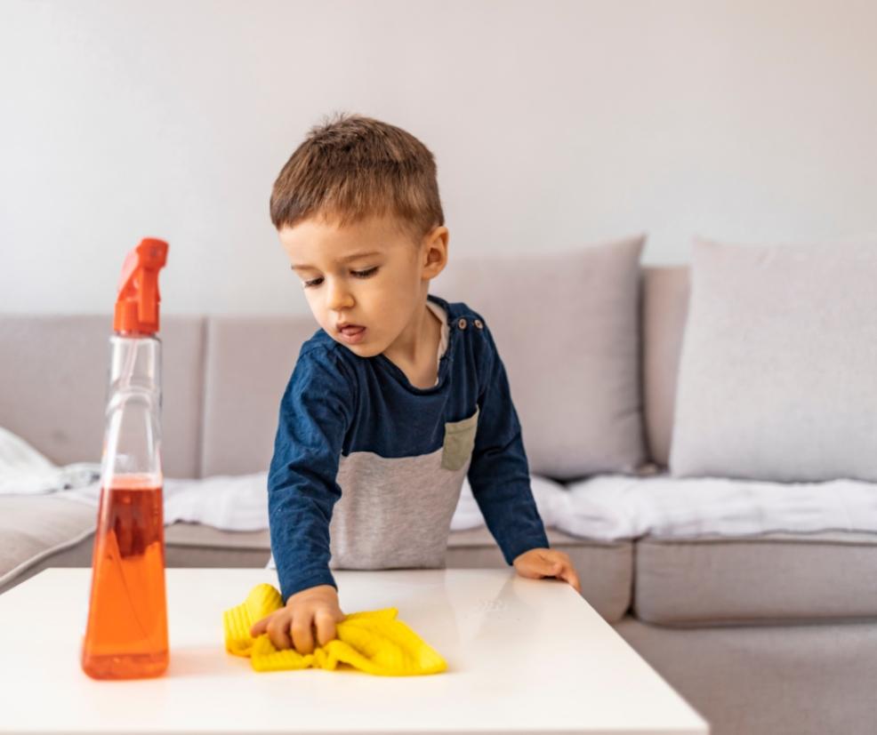 picture of a child cleaning with a wet duster