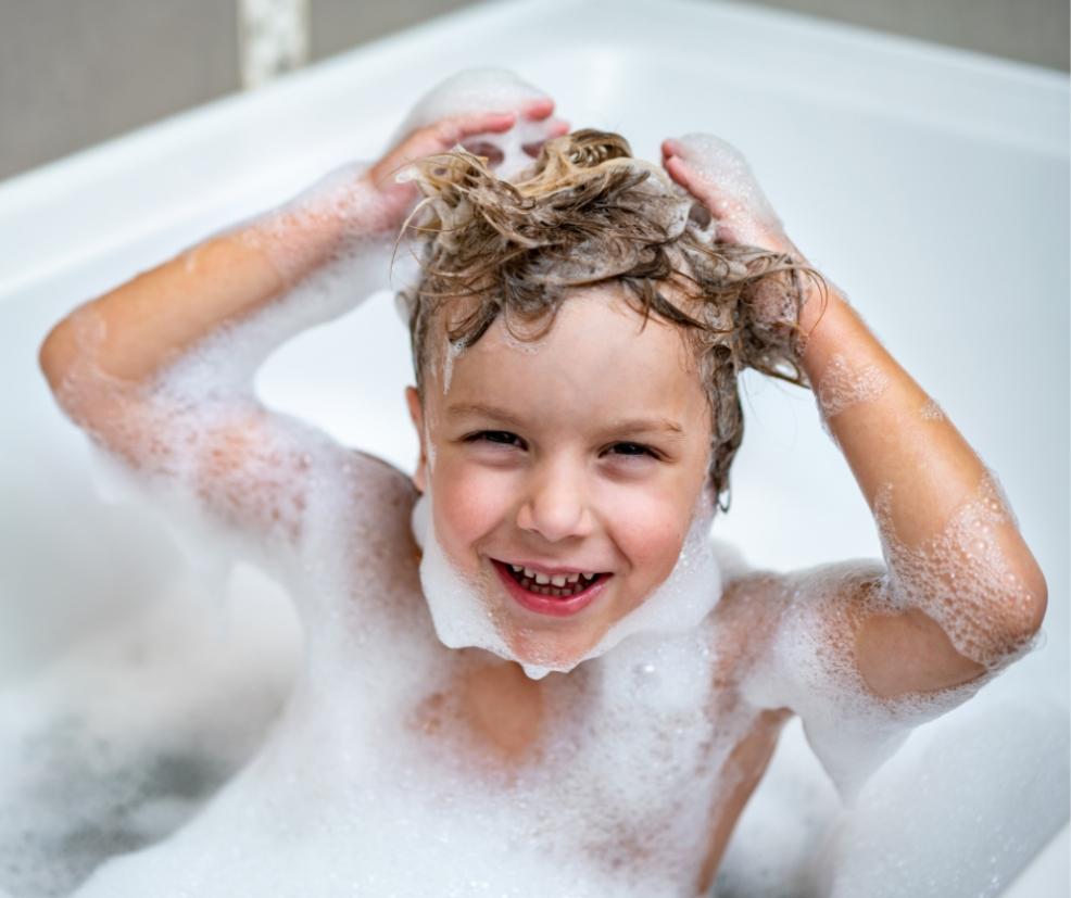 picture of a child in the bath washing their hair