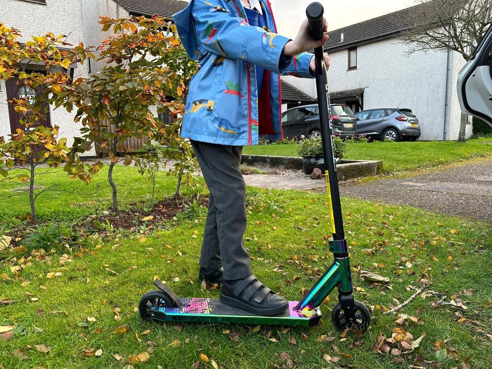 picture of a child on a Rampage R1 2023 Complete Stunt Scooter
