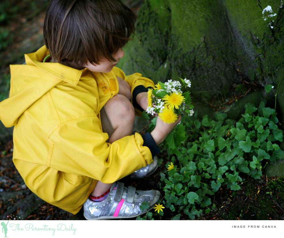 picture of a child picking flowers outside