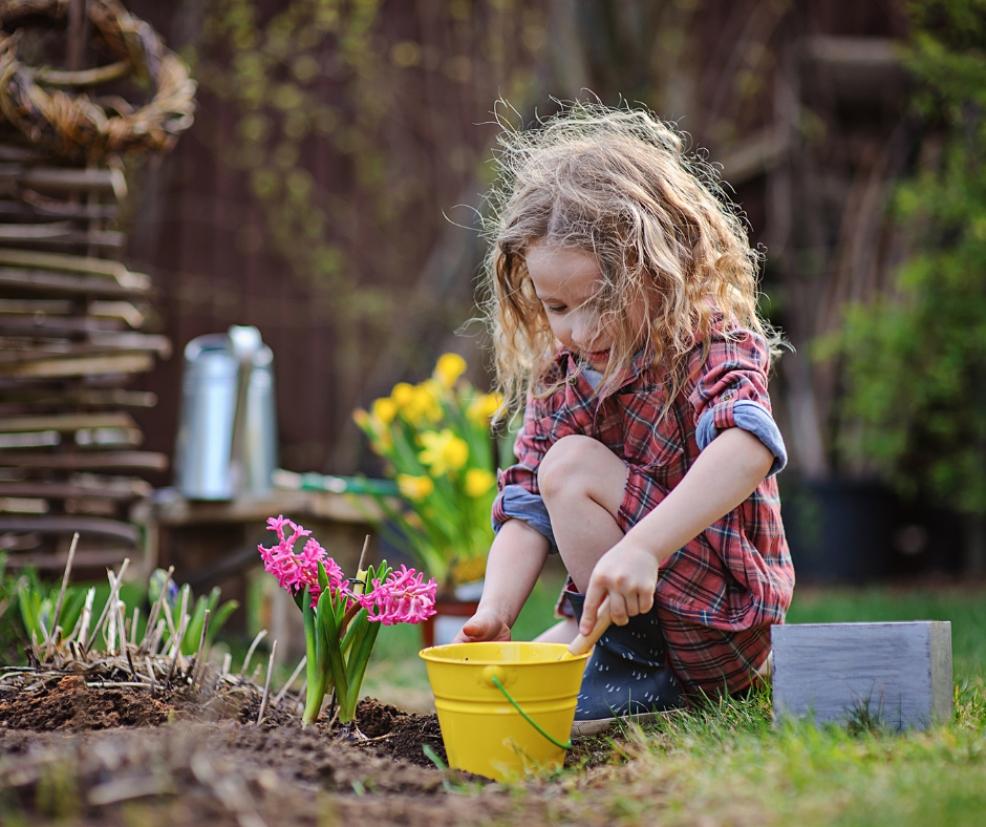 picture of a child playing in the garden