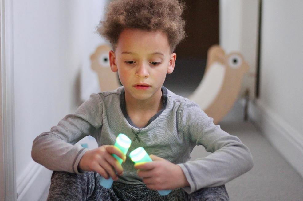 picture of a child using Stix Mindfulness Remotes