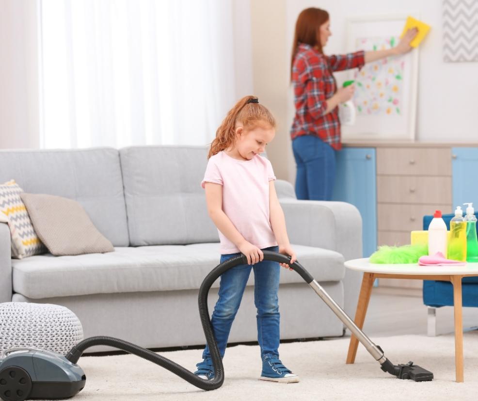 picture of a child using a vacuum cleaner