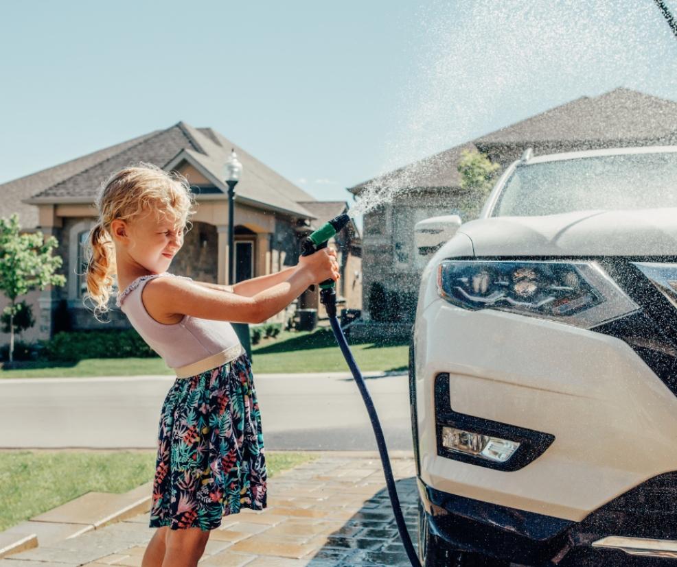 picture of child washing family car