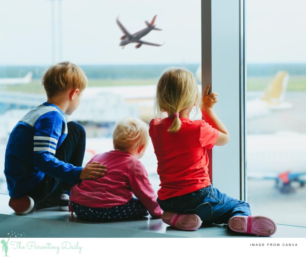 picture of children at the airport watching the planes
