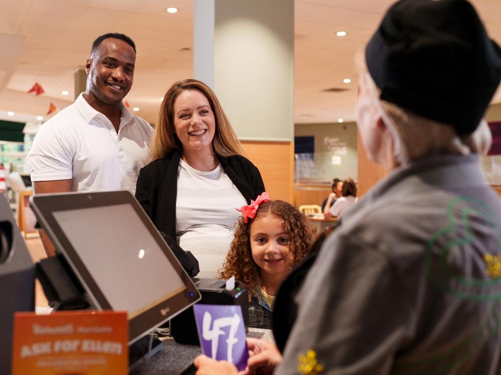 picture of a family at morrisons cafe getting a free crumpet