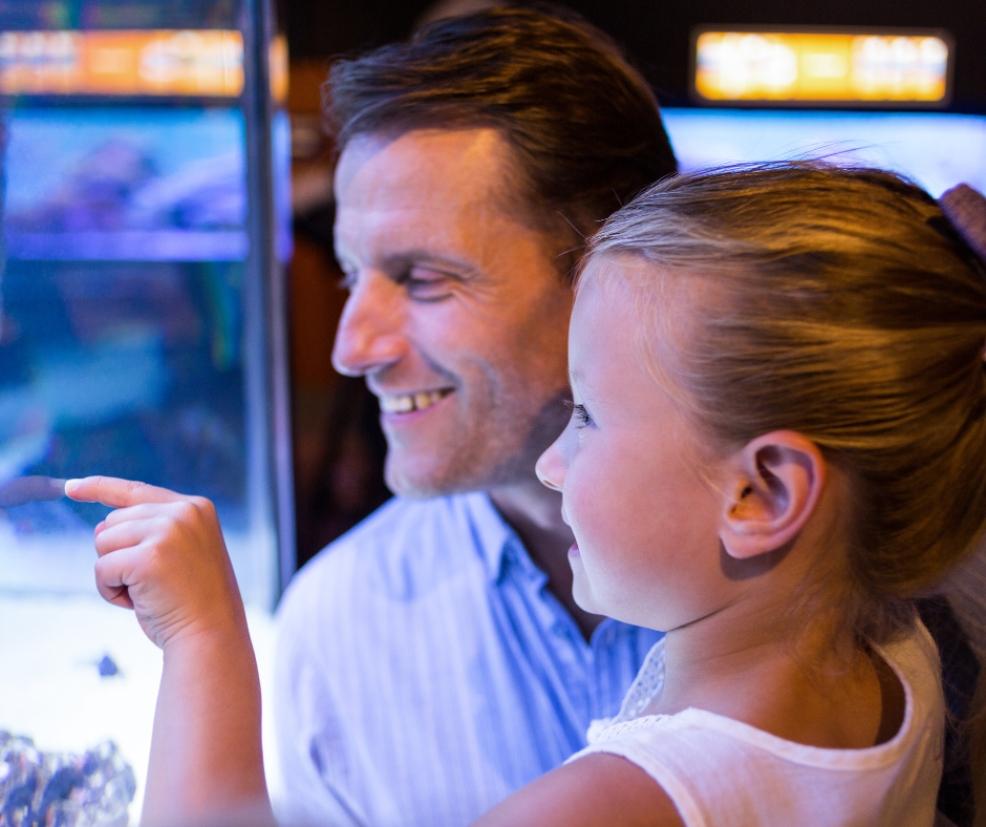 father and daughter at a zoo picture of a father and daughter at a zoo