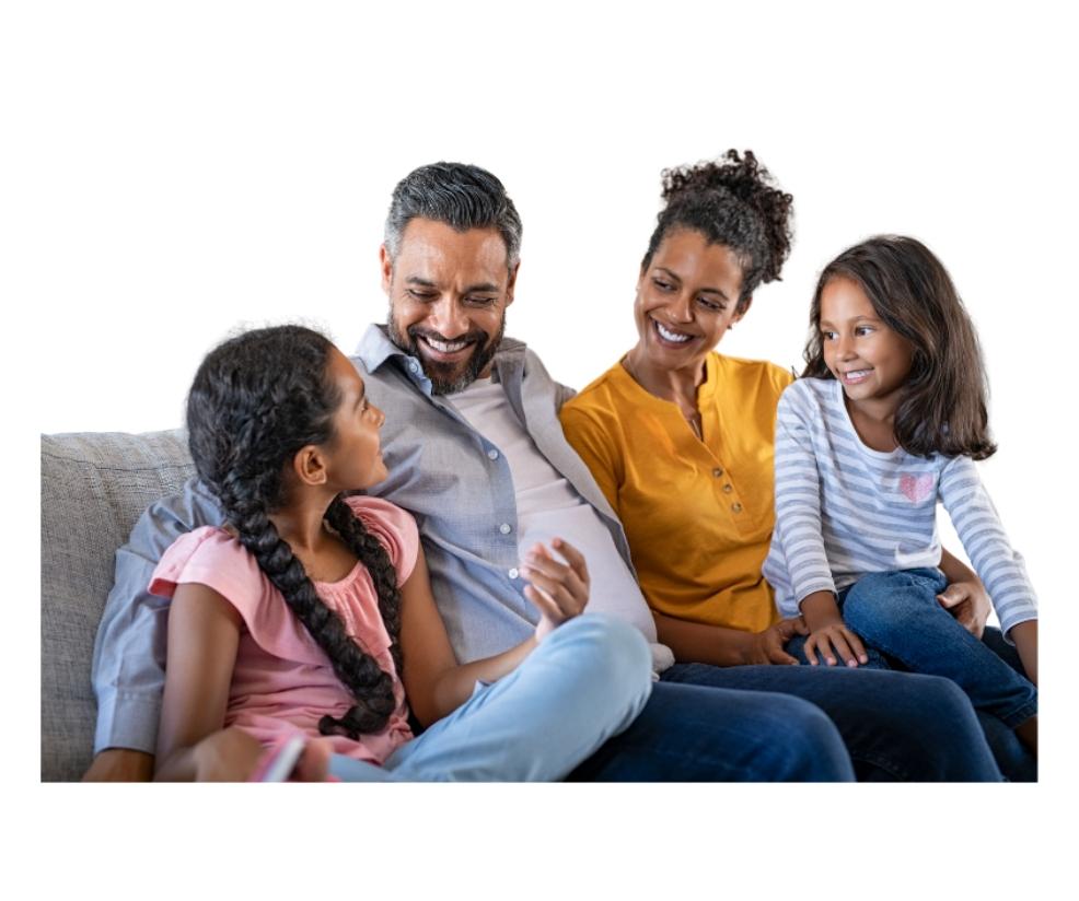 picture of a happy family sat on a sofa