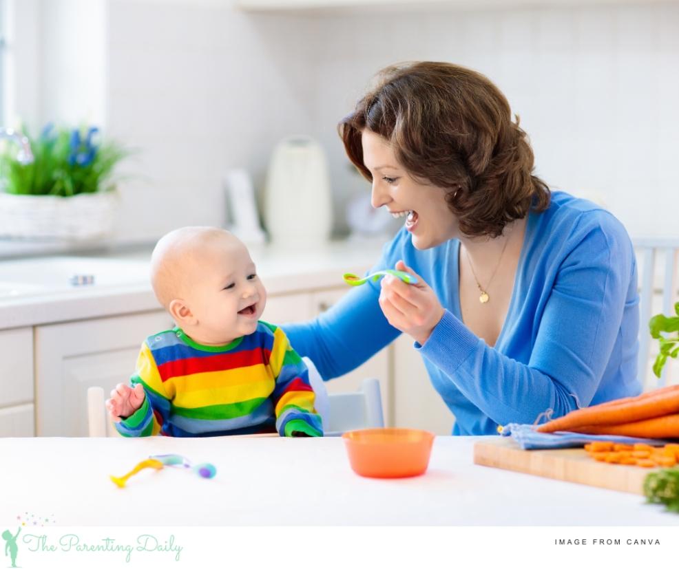 picture of a happy mum weaning her baby