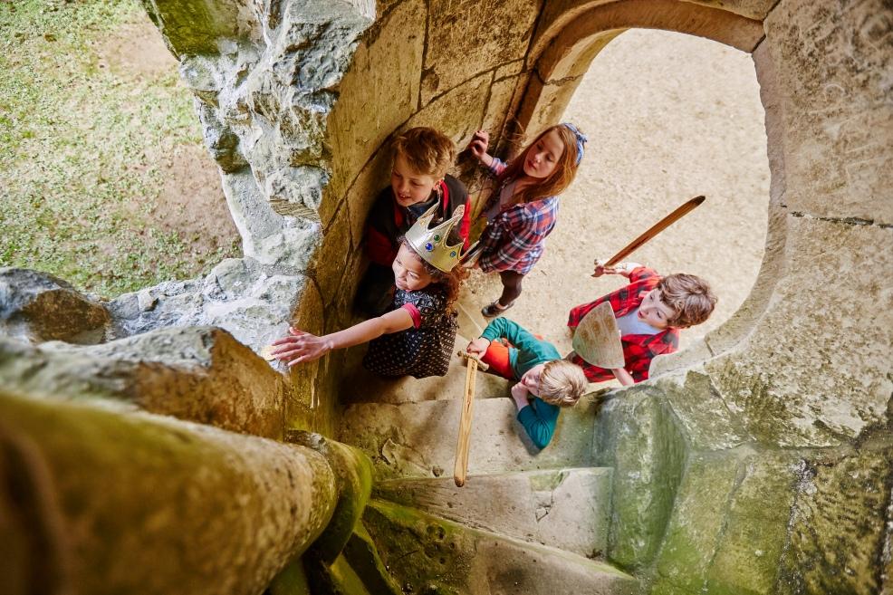 picture of kids roleplaying at castle ruins