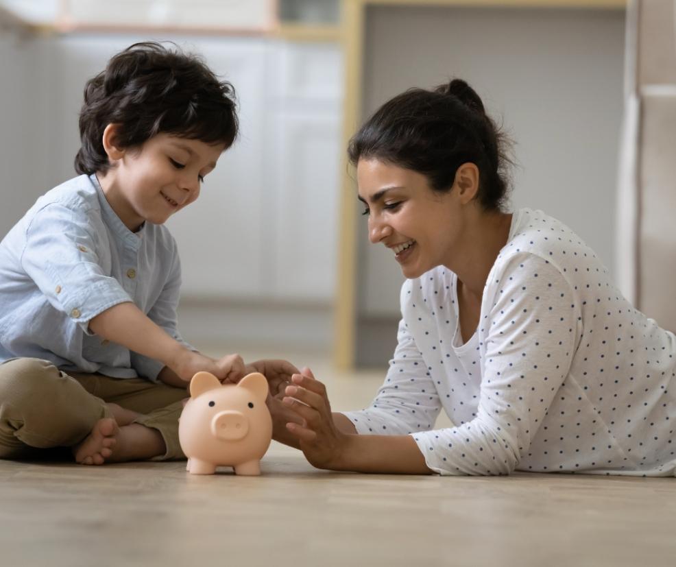 mum teaching child about savings picture of a mum teaching child about savings