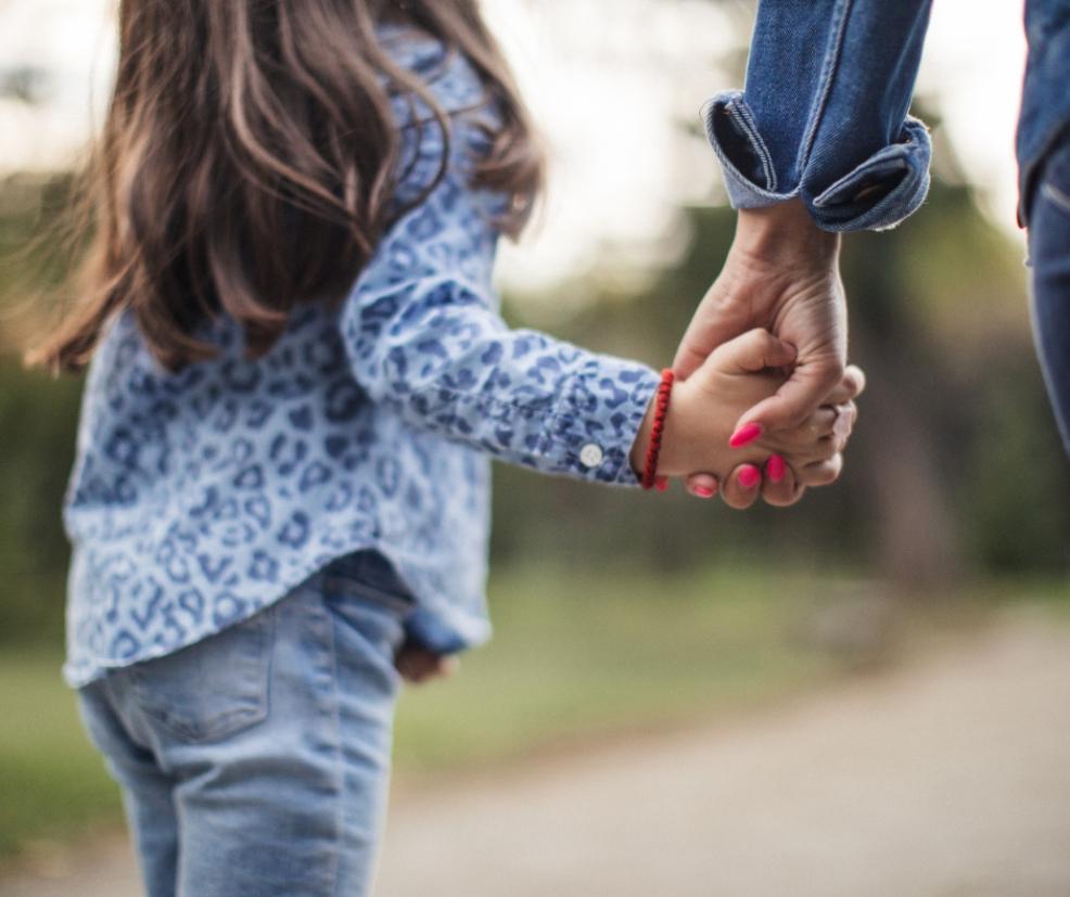 picture of a parent and child holding hands