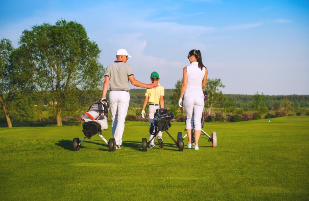 picture of family playing golf