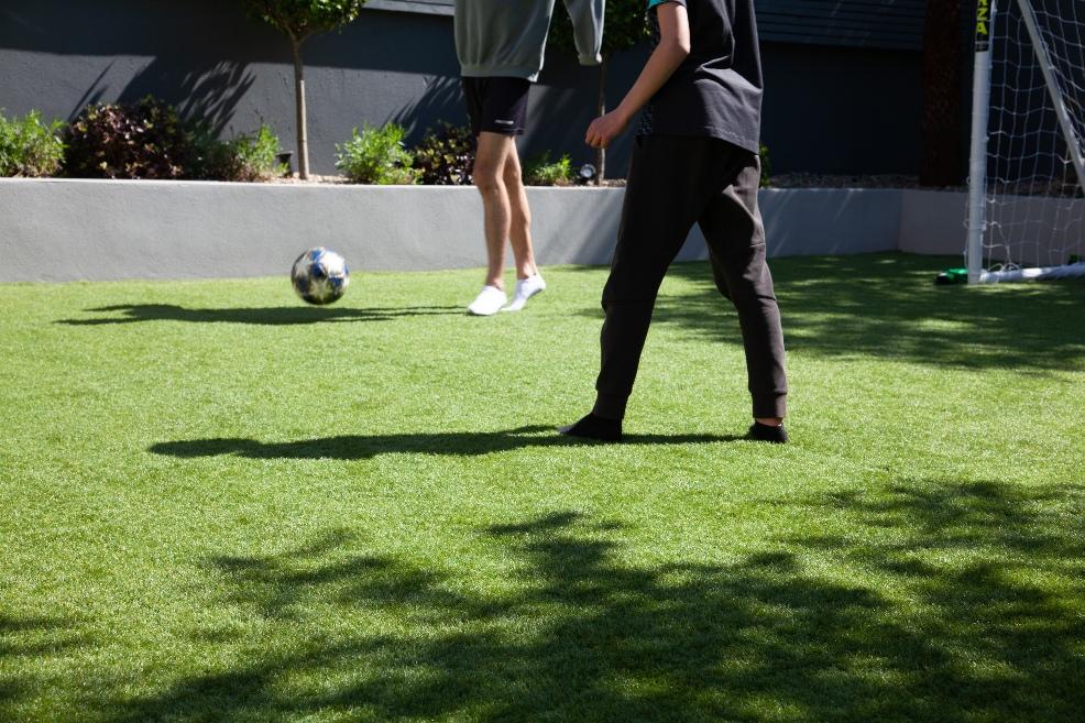 picture of people playing football on artificial grass