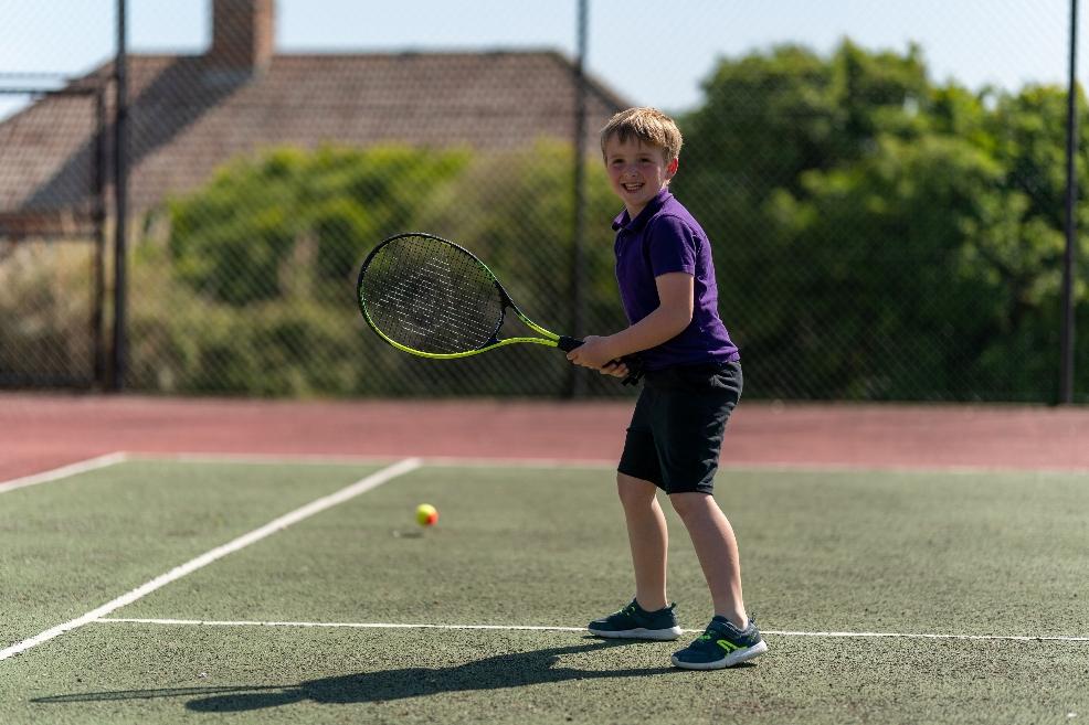 picture of child playing tennis at moonfleet manor hotel dorset