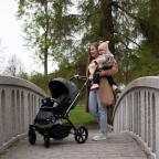 picture of a happy mum and baby on a bridge with their Tutis stroller
