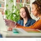 picture of a parent helping prepare her child for sixth form