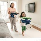 picture of a child helping her mum with some household chores in a fun way