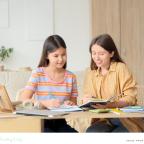picture of a happy child having tutoring which she received as a Christmas gift