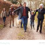 picture of a multi generational family and their dog on a walking holiday