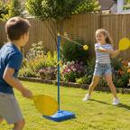picture of Two happy children playing Swingball in a secure family garden with colourful flower beds and wooden fencing