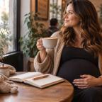 picture of a pregnant woman sat in a coffee shop thinking of coffee themed baby names