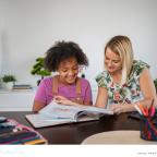 picture of a happy child having tutoring support at home to boost confidence and help with exams