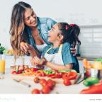 picture of a happy mum and child preparing a healthy nutritious meal together