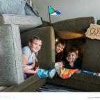 children building a sofa fort at home when not having screen time picture of children building a sofa fort at home when not having screen time