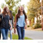 picture of happy teenagers walking down the street thinking about their futures