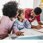 picture of loving parents supporting their child with learning