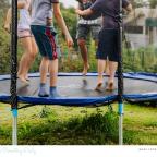 picture of children bouncing on a trampoline outside