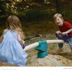 picture of children playing outdoors on a seesaw